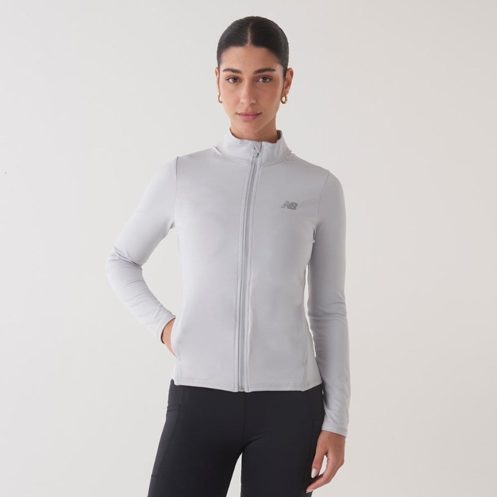 Vista principal Jaqueta Mesclado Performance Feminina New Balance incolor