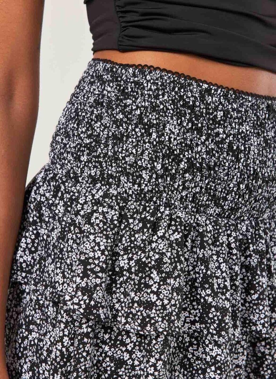 Vista 2 Saia Lastex Babados Preta Florida Youcom estampado