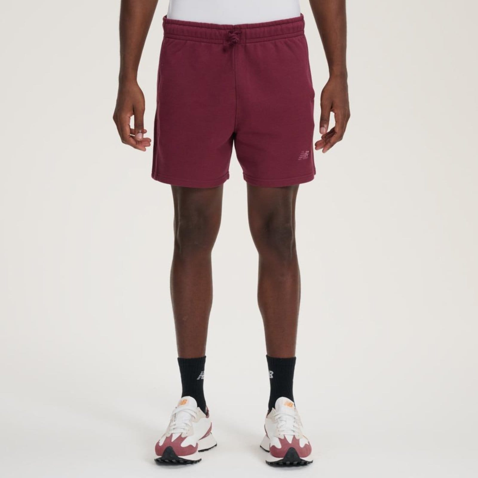 Vista 2 Shorts Athletics Small Logo 5" Masculino" New Balance incolor