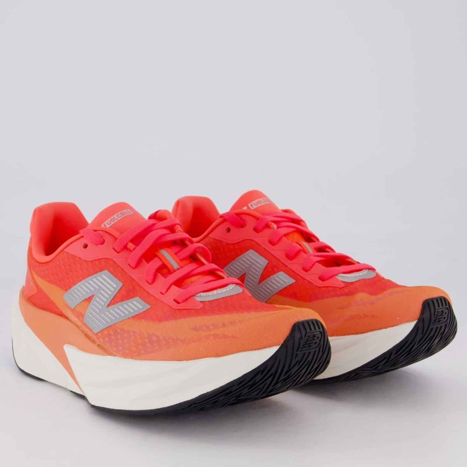 Vista 2 Tênis New Balance Fuelcell Rebel V5 Feminino Coral New Balance laranja coral