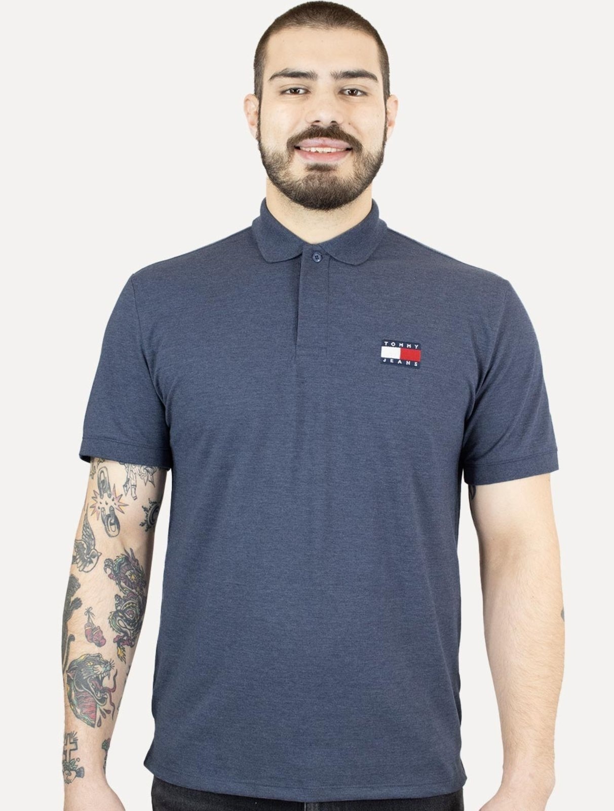 Imagem principal Polo Tommy Jeans Masculina Regular Heather XS Badge Marinho Mescla Tommy Jeans azul marinho